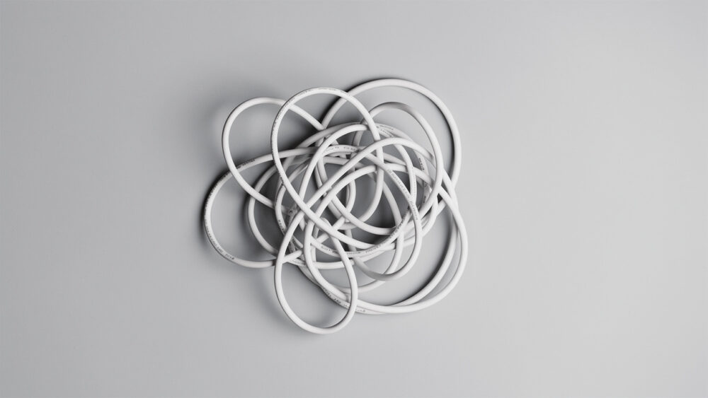 Tangled white cord. Visual representation of customer churn reasons.