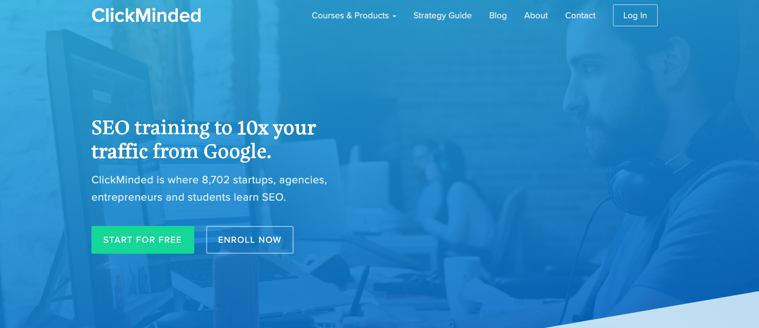 The ClickMinded website's main page offers training in SEO and digital marketing tips to help increase your traffic from Google. There's a button labeled "Start for Free" that lets you begin using the service at no cost. The site also mentions that 8,702 startups, agencies, entrepreneurs, and students are currently using their resources. In the background, there's an image of someone working on a computer.