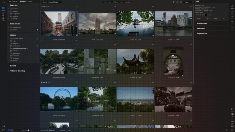 A computer screen shows a photo management program like On1 Photo RAW. You can see small pictures of cities and nature, information about each photo on the right, and menu options for organizing photos on the left. This software is a strong alternative to Lightroom.